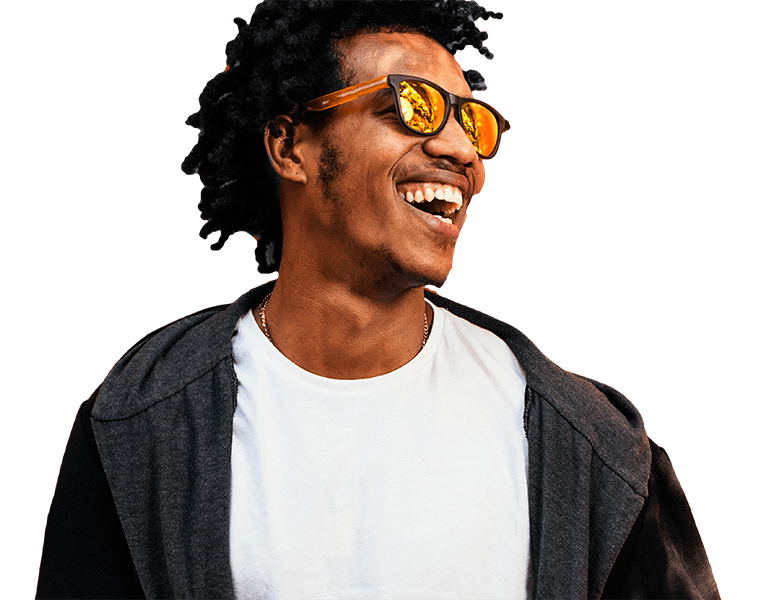 African man smiling wearing sunglasses | Msafiri magazine